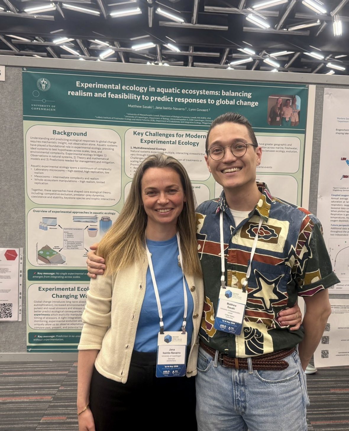 Two researchers standing in front of a conference poster at the 2026 ASLO-SIL meeting