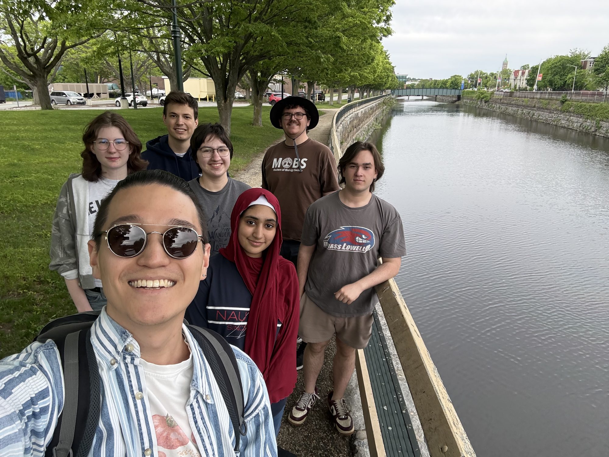 ZEAL lab members taking a group selfie beside a canal